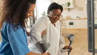 Healthcare caregiver helping a patient with compassion and support