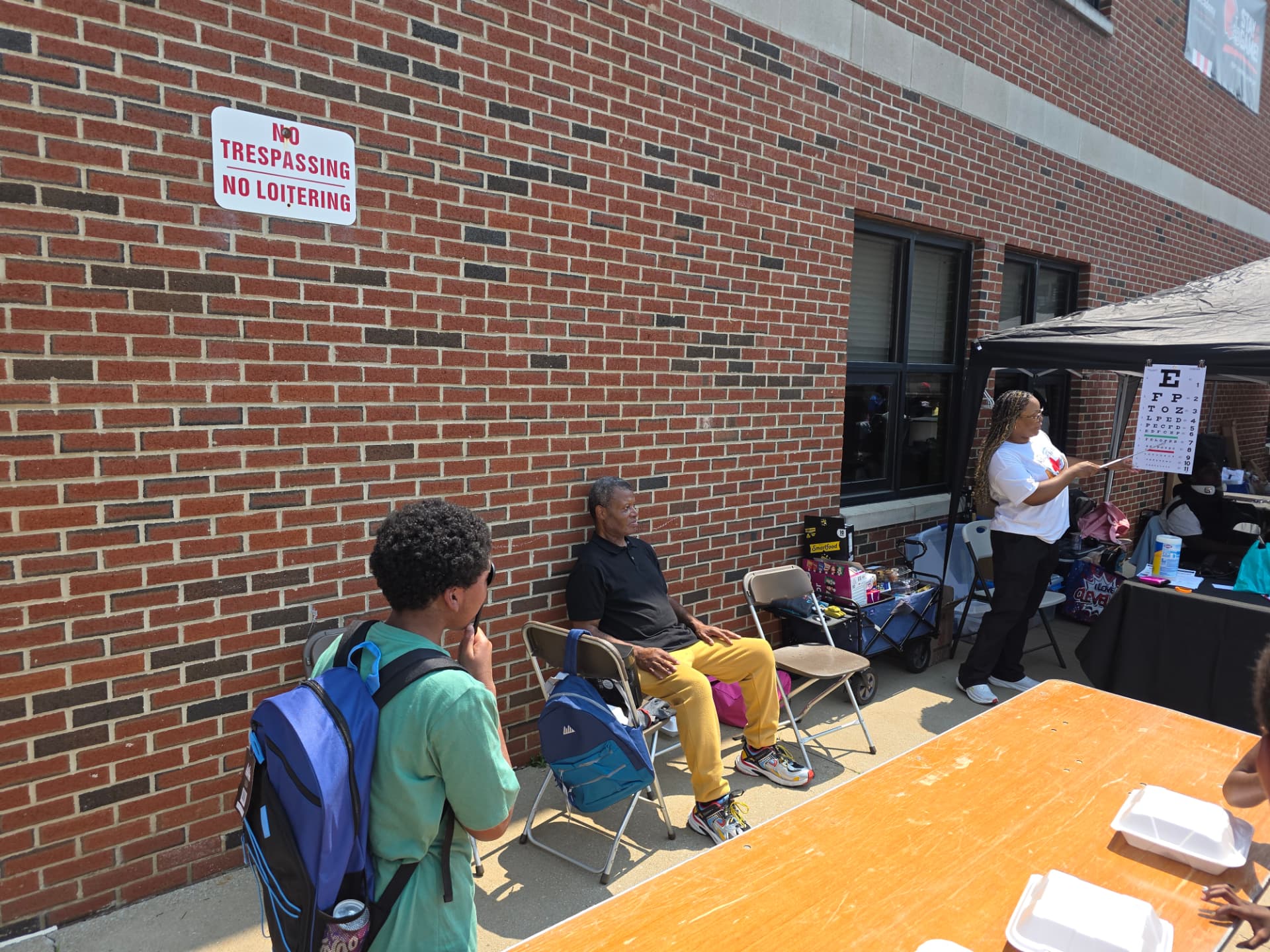 Team member conducting a vision screening at a community health fair